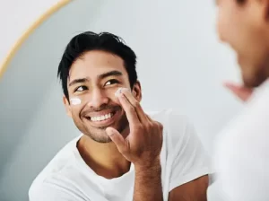 a-man-smiling-at-his-reflection-in-the-mirror.