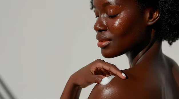 radiant-black-woman-applying-moisturizer-flawless-skin-care_